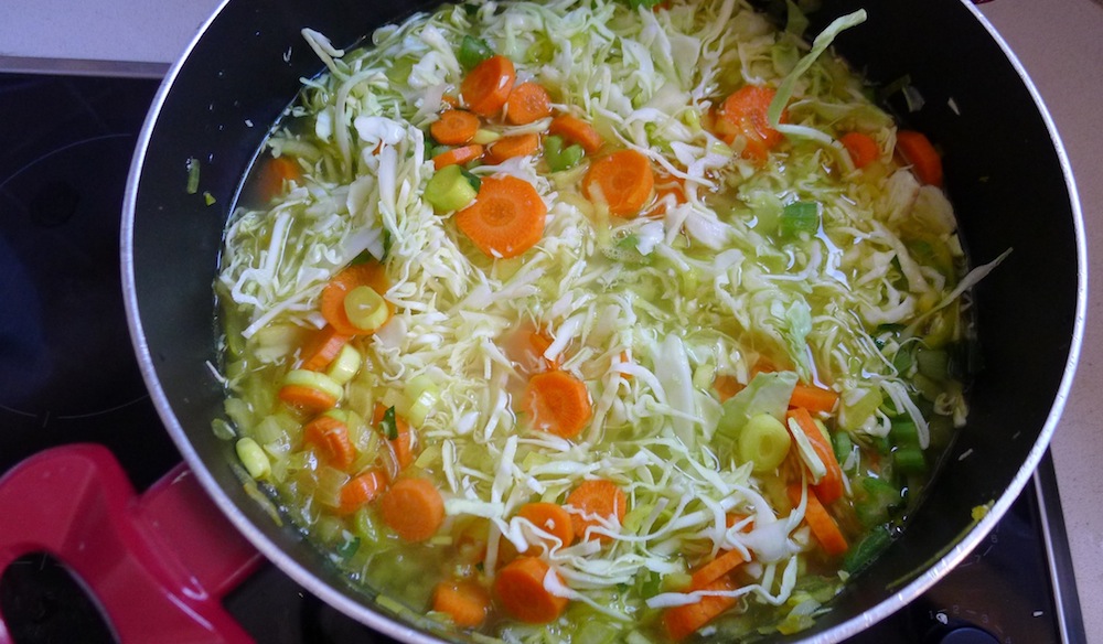 Finally, add the grated cabbage and water
